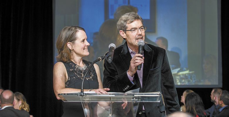 Lynn and Ron Penner-Ash speak after being presented with the “Los Heroes de ¡Salud!” award for their outstanding contributions to the ¡Salud! program. ##Photo by Kathryn Elsesser