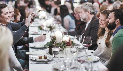 Guests enjoy the 2017 Keeler Estate German Christmas Dinner hosted in the cellar. ##Photo by Heidi Von Tagen