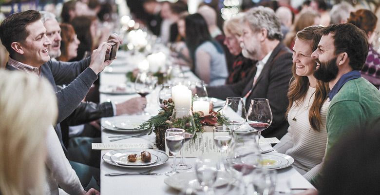 Guests enjoy the 2017 Keeler Estate German Christmas Dinner hosted in the cellar. ##Photo by Heidi Von Tagen