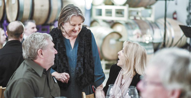 Host Gabriele Keeler chats with guests during the 2017 dinner. ##Photo by Heidi Von Tagen