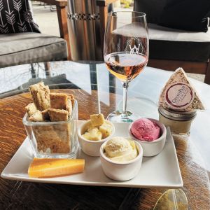 A plate of various cheeses and a glass of rosé from Wooldridge Creek Winery & Creamery in Grants Pass.##Photo provided By Wooldridge Creek Winery & Creamery