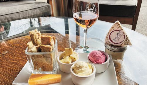 A plate of various cheeses and a glass of rosé from Wooldridge Creek Winery & Creamery in Grants Pass.##Photo provided By Wooldridge Creek Winery & Creamery