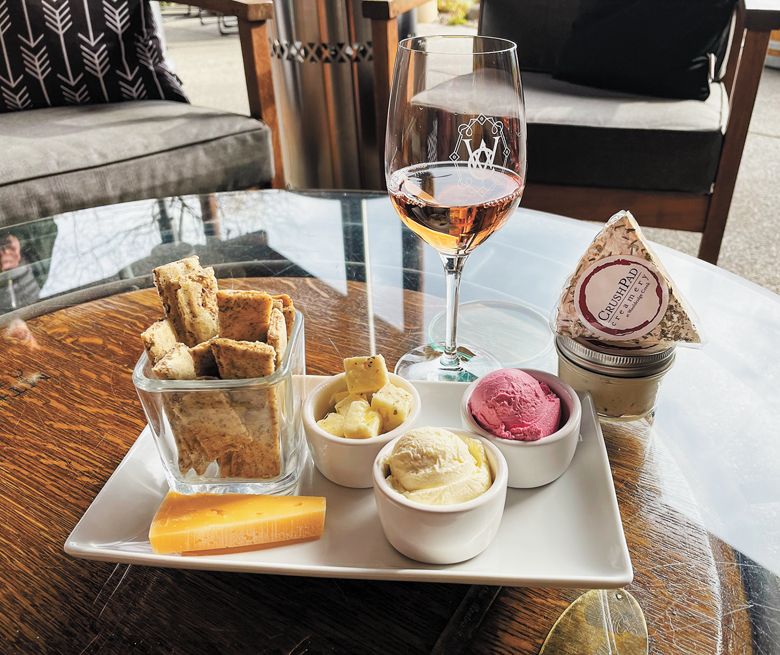 A plate of various cheeses and a glass of rosé from Wooldridge Creek Winery & Creamery in Grants Pass.##Photo provided By Wooldridge Creek Winery & Creamery