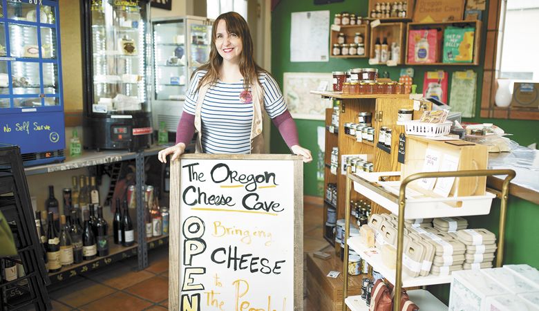 Melodie Picard inside The Oregon Cheese Cave, Phoenix, Oregon. While COVID and the fires slowed business, the passionate proprietor continues her mission to share hand-picked gourmet cheeses, meats, wines and more with her Southern Oregon community and tourists, too. ##Photo by Jean-Francois Durand