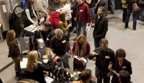 At Rex Hill, winery members of  the Chehalem Mountains Winegrowers pour samples for trade members to taste.  Photo by Andrea Johnson.