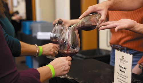 Attendees receiving wine samples during the Nouveau Release Party, held at Chemeketa Eola s Northwest Wine Studies Center. ## Photo provided by Chemeketa Community College