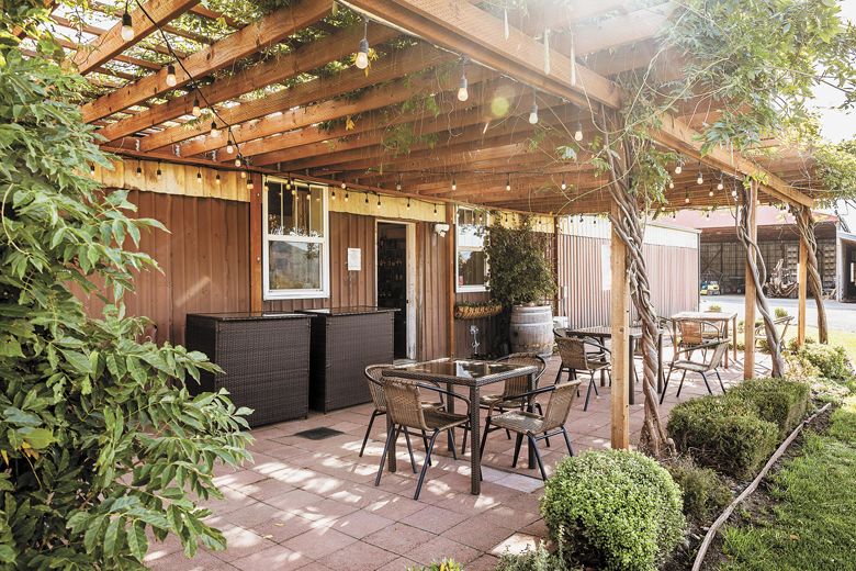 The outdoor patio at Cliff Creek Cellars’ property in Gold Hill’s Sams Valley.##Photo provided by Cliff Creek Cellars The outdoor patio at Cliff Creek Cellars’ property in Gold Hill’s Sams Valley.##Photo provided by Cliff Creek Cellars