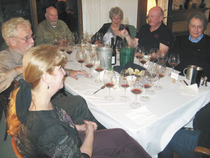 Participants in the 1985 Oregon Pinot tasting included co-host Judy Erdman (foreground), Amity Vineyards founder Myron Redford (behind Erdman) and Erath Vineyards founder Dick Erath (to Redford’s left), among others. The group gathered at Erdman’s home in Portland. Photo by Karl Klooster. Participants in the 1985 Oregon Pinot tasting included co-host Judy Erdman (foreground), Amity Vineyards founder Myron Redford (behind Erdman) and Erath Vineyards founder Dick Erath (to Redford’s left), among others. The group gathered at Erdman’s home in Portland. Photo by Karl Klooster.