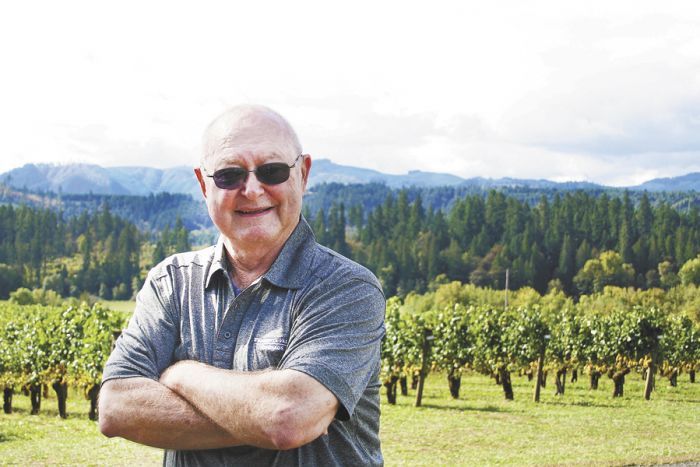 Bill Fuller stands among the vines he planted at Tualatin Estate Vineyard in 1973. Photo provided.