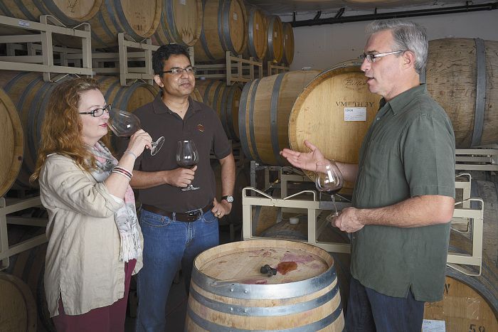 Tony Rynders discusses wine with Saffron Fields owners Sanjeev Lahoti and Angela Summers. Rynders is the red winemaker for the Yamhill-Carlton winery. Photo by Andrea Johnson Tony Rynders discusses wine with Saffron Fields owners Sanjeev Lahoti and Angela Summers. Rynders is the red winemaker for the Yamhill-Carlton winery. Photo by Andrea Johnson