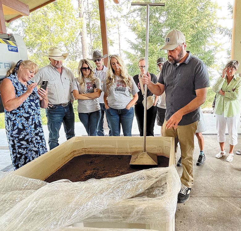 A punchdown demonstration at Cooper Ridge Vineyard. Funds raised by Umpqua Valley Winegrowers Association members benefited Umpqua Community Action Network s food bank. ## Photo by Gail Oberst