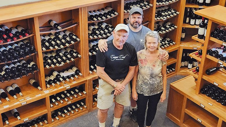 Dave and Debbie Hansen standing with their son, Seth. ## Photo provided by Cougar Crest Estate Winery Dave and Debbie Hansen standing with their son, Seth. ## Photo provided by Cougar Crest Estate Winery