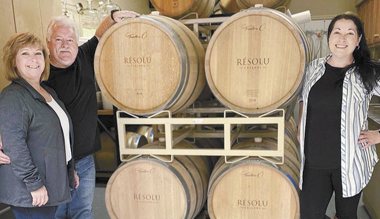 Scott and Kathie Nelson of Résolu Cellars (left) share barrel samples with Erin Palmer of The Wine Cellar. ##Photo provided
