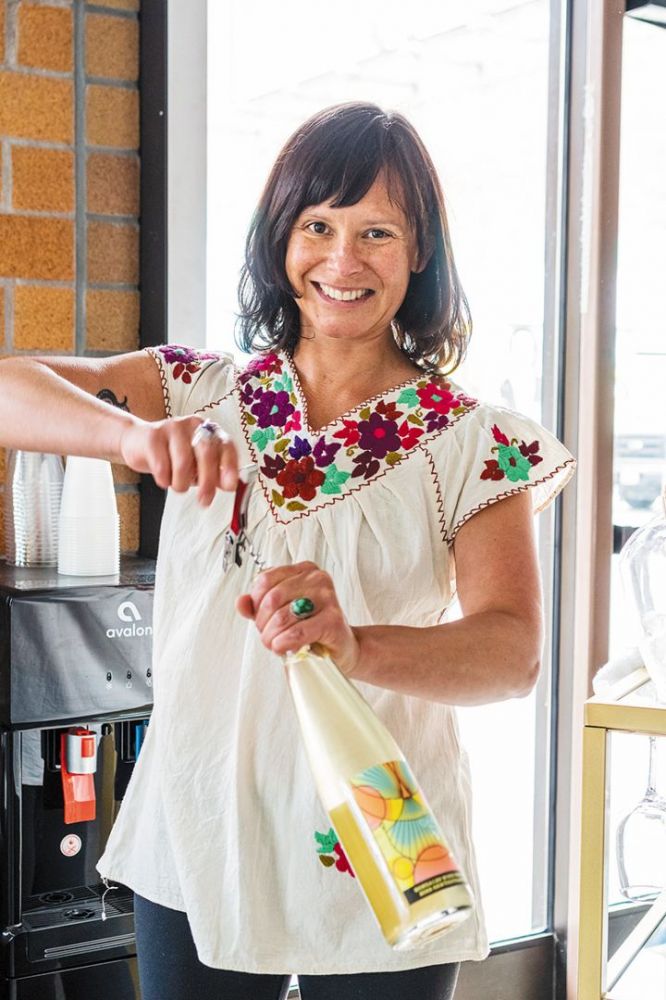 Cristina Gonzales, owner and winemaker of Gonzales Wine Company, opening a wine bottle. ## Photo provided by Gonzales Wine Company Cristina Gonzales, owner and winemaker of Gonzales Wine Company, opening a wine bottle. ## Photo provided by Gonzales Wine Company