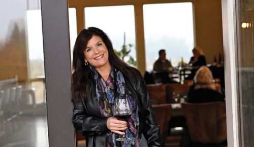 2022 Person of the Year Janie Brooks Heuck welcomes guests from the entrance of the Brooks Wine tasting room and winery.