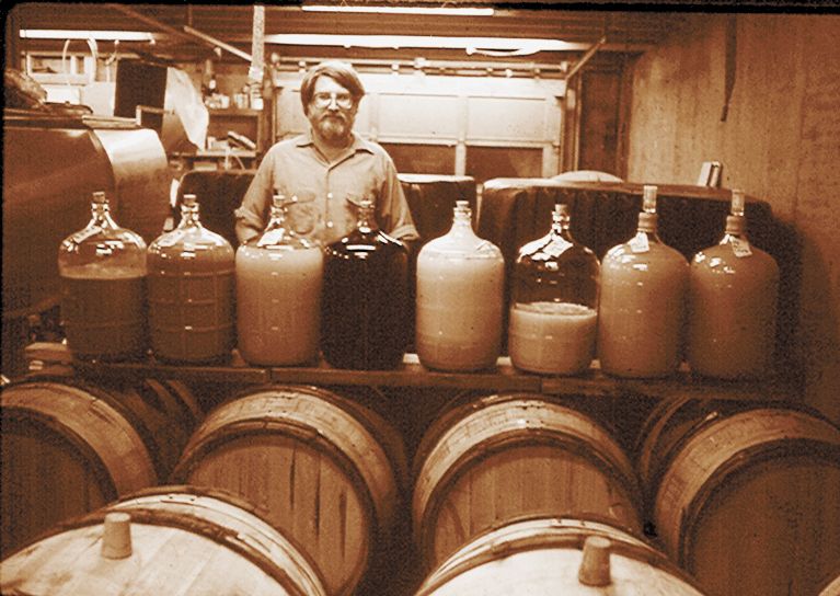 David Adelsheim in basement winery, 1980 or 1981. ##Photo courtesy of Adelsheim Vineyard