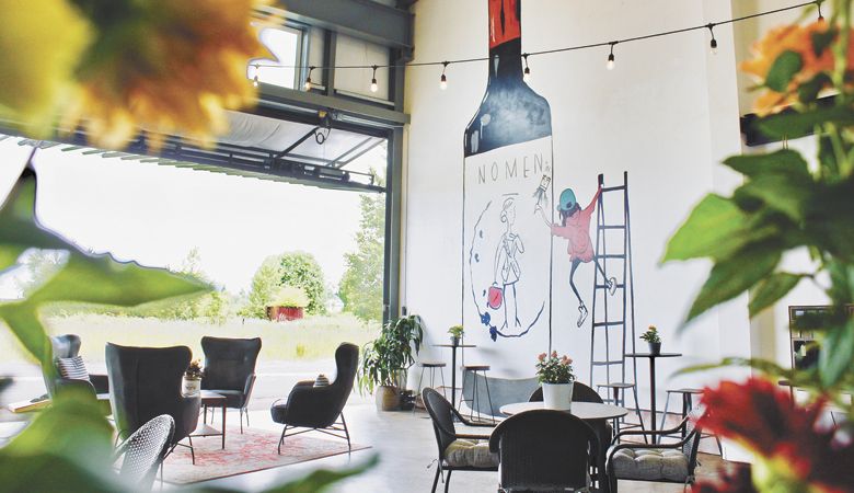 The Distaff Wine Company tasting room in Newberg features roll-up doors, eclectic décor and bright murals painted by mom Angelica O’Reilly. ##Photo provided