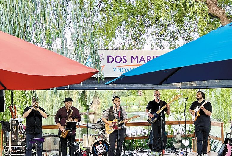A band playing music on Dos Mariposas’ outdoor patio. ## Photo provided by Dos Mariposas Vineyards & Lavender Farm