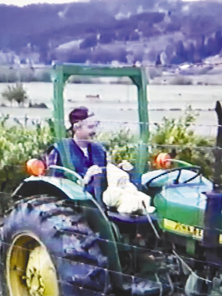 Doyle Himan with baby Chelsea on a tractor. ## Photo provided by Hinman Vineyards