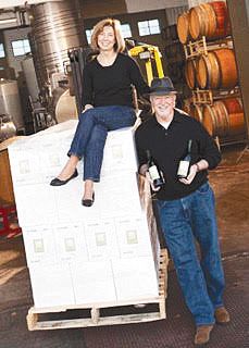 Sue Ann and Doyle Hinman with cases of wine. ## Photo provided by Hinman Vineyards