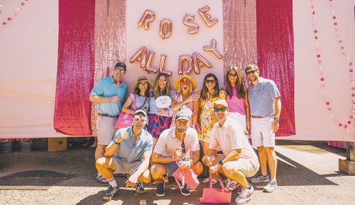 A group of Drink Pink attendees posing for a photo. ## Photo BY Reymundo Vargas-Martinez
