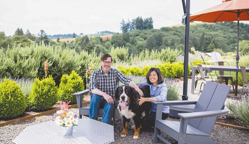 Tom Fitzpatrick seated with wife France and dog Four on Élevée’s welcoming patio. ##Photo provided by Élevée Winegrowers