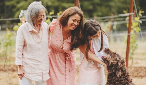 Et Fille Wines  Jessica Mozeico (in pink), standing between her mother, Mona, and daughter, Gabriella, with family dog, Coco Chanel. ## Photo by Foundry 503