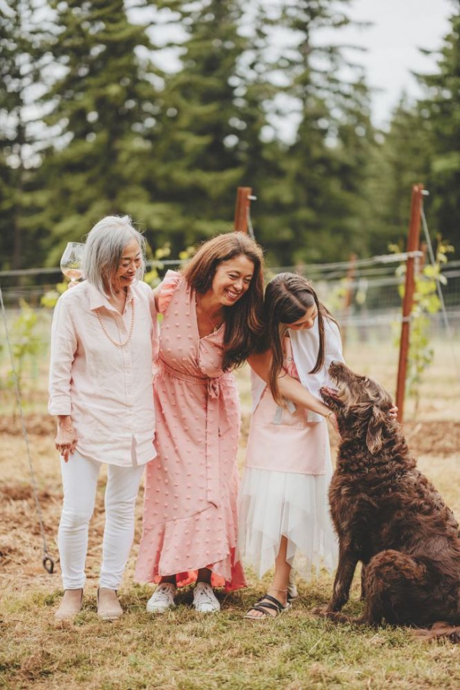 Et Fille Wines  Jessica Mozeico (in pink), standing between her mother, Mona, and daughter, Gabriella, with family dog, Coco Chanel. ## Photo by Foundry 503