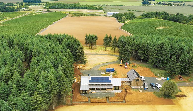 Crews at Open Claim Vineyard in Dallas work hard to finish the spacious building. ##Photo by Andrea Johnson