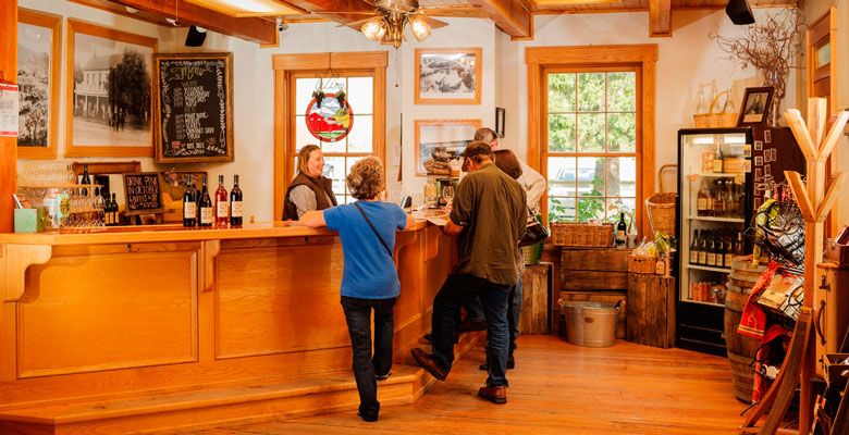 Courtney Thomas welcomes guests at Del Rio Vineyards in Gold Hill. ##Photo by Kathryn Elsesser