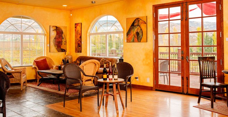 Paschal Winery offers relaxation in its airy tasting room, located in Talent near Ashland. Featured artwork covers the walls and seating outside is available for guests to enjoy the Rogue Valley weather. ##Photo by Kathryn Elsesser