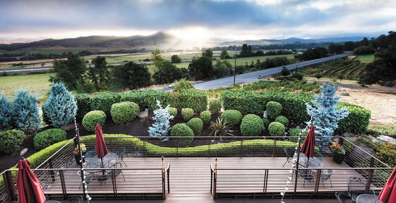 The deck at Weisinger Family Winery, located in Ashland, gives visitors a gorgeous view of the surrounding Rogue Valley. ##Photo by Mark Mularz