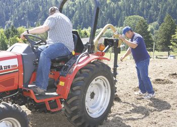 Workers prepare the ground to plant Nebbiolo grapevines at the SOWI/UCC vineyard. The vines were donated by Eckhard Kaesekamp, owner/manager of Lake County Grapevine Nursery Operations. Photo by Gary Leif.