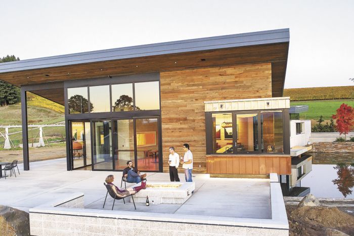 The modern firepit acts as a gathering place on the expansive patio. The modern firepit acts as a gathering place on the expansive patio.