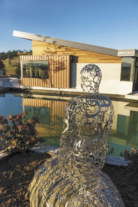 Jaume Plensa’s “Tale Teller II,” a life-sized sculpture crafted from stainless steel and stone sits at the edge of one of the ponds at Saffron Fields’ new tasting room. Jaume Plensa’s “Tale Teller II,” a life-sized sculpture crafted from stainless steel and stone sits at the edge of one of the ponds at Saffron Fields’ new tasting room.