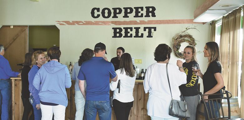 Travis Cook pours samples of his wines at Copper Belt’s new tasting room in downtown Baker City, across from the historic Geiser Grand Hotel, built in 1889. ##Photo by Timothy Bishop