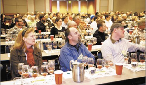 Symposium attendees like Sean Driggers of Pudding River Cellars (middle front) and Joshua Wilkinson of Ponzi (far right) attend a session titled “Under Cover: Vineyard Floor Management to Manipulate Vines and Wines.” The session include a wine tasting revealing different cover crops’ effect on taste.