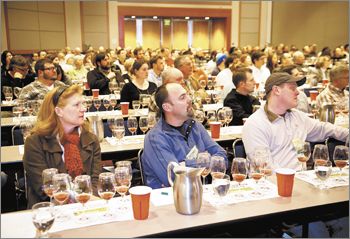 Symposium attendees like Sean Driggers of Pudding River Cellars (middle front) and Joshua Wilkinson of Ponzi (far right) attend a session titled “Under Cover: Vineyard Floor Management to Manipulate Vines and Wines.” The session include a wine tasting revealing different cover crops’ effect on taste.