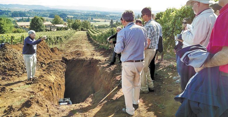 Geologist Dr. Scott Burns speaks to a crowd attending a site visit at Stoller Family Estate in Dayton during the International Terroir Congress, which was hosted for the first time in Oregon, July 10–14. ##Photo by Maureen Battistella