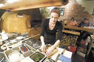 The Blue Goat in Amity recently opened its doors in the small wine country town of Amity. Co-owner/chef Cassie VanDomelen assembles a pizza. The Blue Goat in Amity recently opened its doors in the small wine country town of Amity. Co-owner/chef Cassie VanDomelen assembles a pizza.