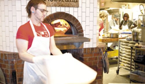 Joshua Shaham, Cathy Whims and Hilary Berg talk pizza and passion at Nostrana in Portland.  Photo by Andrea Johnson.