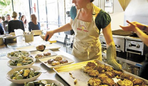 Chef Abby Fammartino with sous chef Eric Belanger prepare the evening’s glutenfree meal at Abby’s Table.