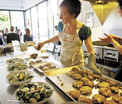 Chef Abby Fammartino with sous chef Eric Belanger prepare the evening’s glutenfree meal at Abby’s Table.