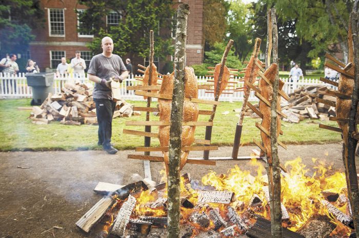 Timberline Lodge Executive Chef Jason Stoller Smith administers the famous Salmon Bake at last year’s IPNC on Linfield College’s campus in McMinnville. Photo by Robert Holmes.