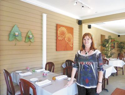 Joyce Prahl of Déjà Vu Bistro & Winebar in the garden room. Photo by Janet Eastman.