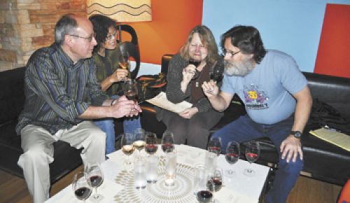 Friends from Corvallis (from left), Patrick Hadlock, Cynthia Spencer, Jerri Bartholomew and John Kaufman sample wine
and small plates at Vino Paradiso in Portland.