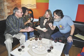 Friends from Corvallis (from left), Patrick Hadlock, Cynthia Spencer, Jerri Bartholomew and John Kaufman sample wine
and small plates at Vino Paradiso in Portland. Friends from Corvallis (from left), Patrick Hadlock, Cynthia Spencer, Jerri Bartholomew and John Kaufman sample wine
and small plates at Vino Paradiso in Portland.