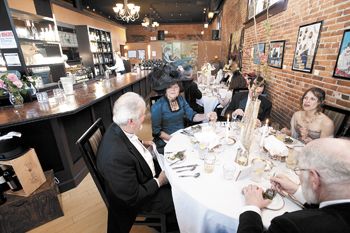 Period-attired Jerry and Susan Murphy enjoy the oysters Rockefeller at Latitude one’s titanic 100th anniversary dinner in Dallas, OR