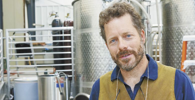 Brian McCormick, inside the new wine production area at Idiot’s Grace.