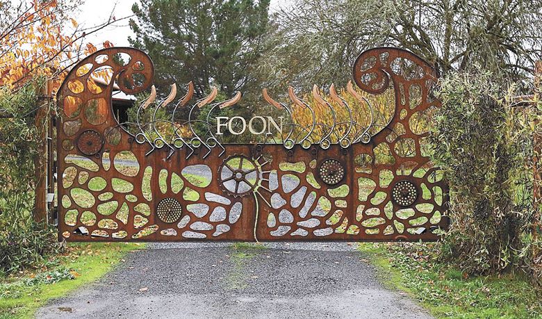 The gate at FOON Estate was designed by Feldman, who used old farming implement parts. ##Photo provided